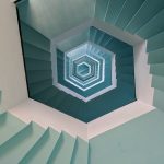 empty gray and white concrete spiral stairs